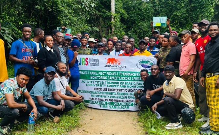 Participants of the Biodiversity Monitoring Training pose for a group photo at Tiwai Island Wildlife Sanctuary, Sierra Leone. The training brought together 40 participants to build capacity in biodiversity monitoring techniques within one of West Africa's most significant remaining tracts of lowland rainforest.