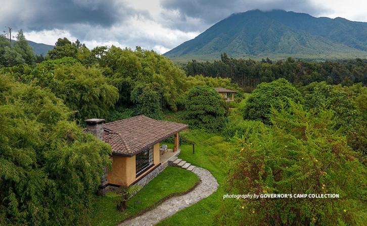 Photo of chalet at Sabyinyo Silverback Lodge in Rwanda with Mount Sabyinyo in the background