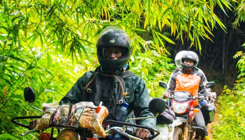 Jeancy Luaka - Motorcycle Rider navigates through the dense Lomako-Yokokala Faunal Reserve