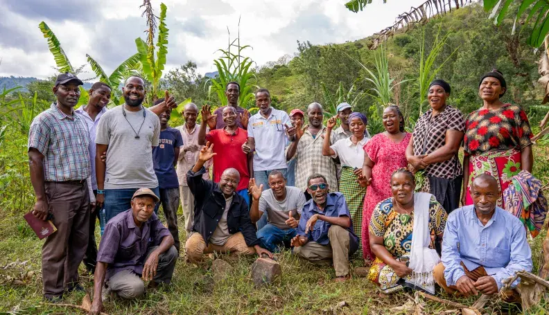 Chief Mwakio with community members engaged in restoration efforts across Bura