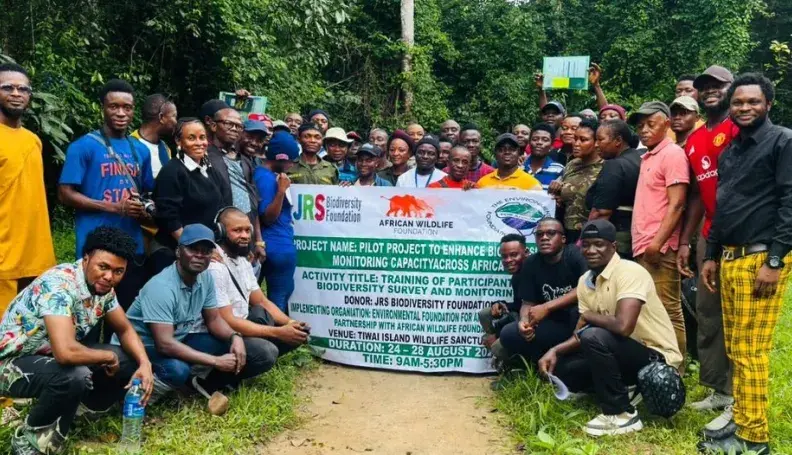 Participants of the Biodiversity Monitoring Training pose for a group photo at Tiwai Island Wildlife Sanctuary, Sierra Leone. The training brought together 40 participants to build capacity in biodiversity monitoring techniques within one of West Africa's most significant remaining tracts of lowland rainforest.