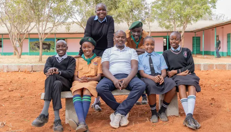 Patrick Kiminza, teacher and Wildlife Club Patron at Ngwata Comprehensive School, with some of his students.