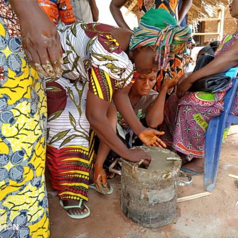 Community members stove making