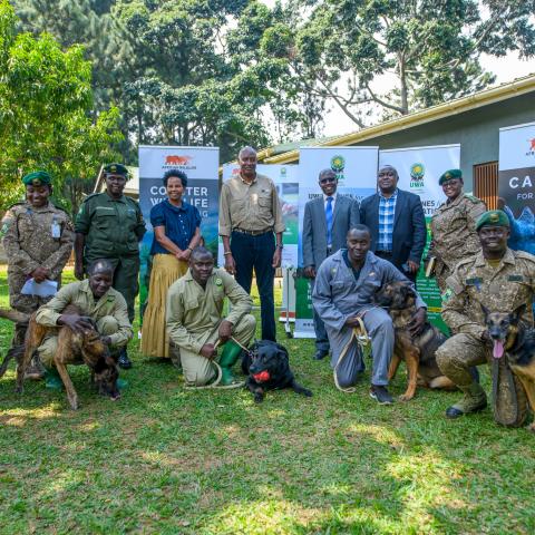 AWF CEO Kaddu Sebunya, AWF Uganda Country Director Rose Ssebatindira, and Uganda Wildlife Authority Representatives during the program transition ceremony for the Canine Units in Uganda.