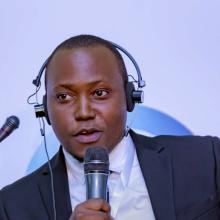Derrick Mugisha speaking at panel at Africa Protected Areas Congress