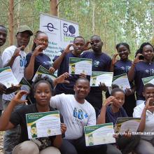 Photo of Earth Day Network Uganda Coordinator Derrick Mugisha with volunteers during environmental event