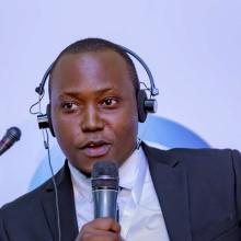 Derrick Mugisha speaking at panel at Africa Protected Areas Congress