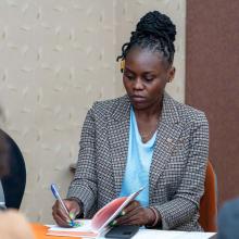 Jane Otieno at a desk