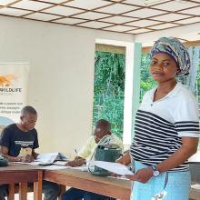 A woman stands in a business training