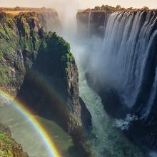 Rainbows by a beautiful waterfall landscape 