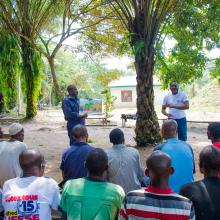 Jean Ayolo Yokolo and AWF Senior Social Safeguards Officer, Dodo Moke at one of their presentations to the scouts
