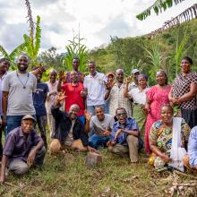 Chief Simon Mwakio (far left) with community members engaged in restoration efforts across Bura