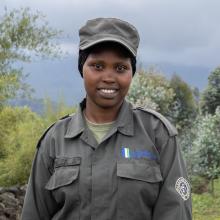 Meet Umuhoza Aline, a Community Eco-Guard serving in Rwanda’s Volcanoes landscape.