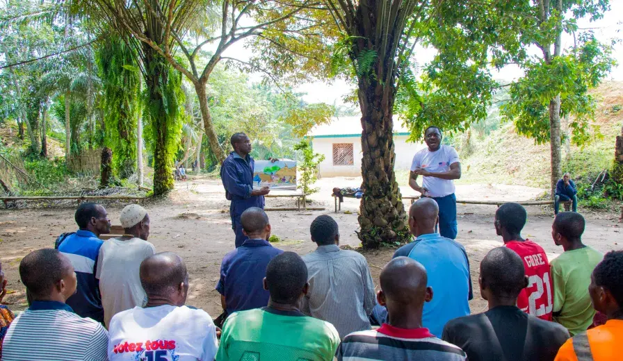 Jean Ayolo Yokolo and AWF Senior Social Safeguards Officer, Dodo Moke at one of their presentations to the scouts