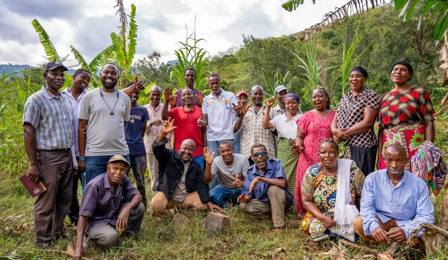 Chief Simon Mwakio (far left) with community members engaged in restoration efforts across Bura