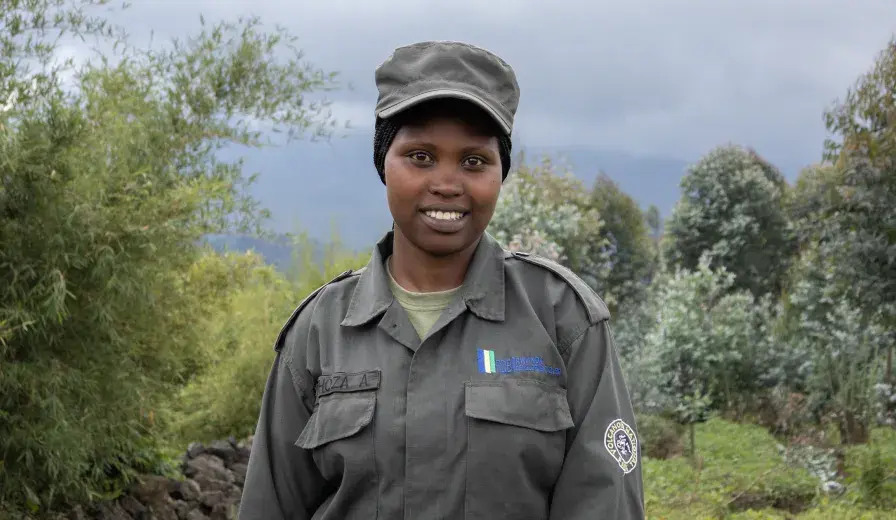 Meet Umuhoza Aline, a Community Eco-Guard serving in Rwanda’s Volcanoes landscape.