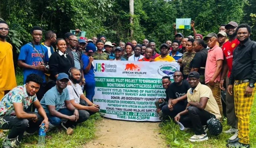 Participants of the Biodiversity Monitoring Training pose for a group photo at Tiwai Island Wildlife Sanctuary, Sierra Leone. The training brought together 40 participants to build capacity in biodiversity monitoring techniques within one of West Africa's most significant remaining tracts of lowland rainforest.