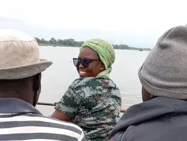Maeva crossing river Faro to go collect data for her first time..jpeg