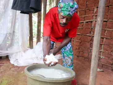 Ndamey Rene showing some of the cassava he harvested from his farm in January 2026