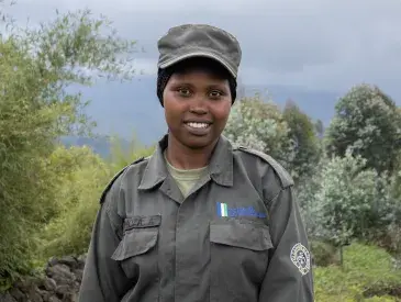 Meet Umuhoza Aline, a Community Eco-Guard serving in Rwanda’s Volcanoes landscape.