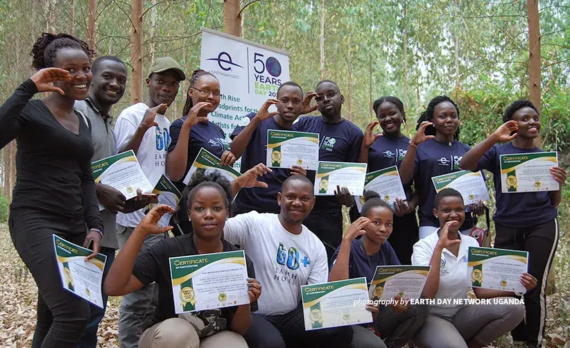 Photo of Earth Day Network Uganda Coordinator Derrick Mugisha with volunteers during environmental event