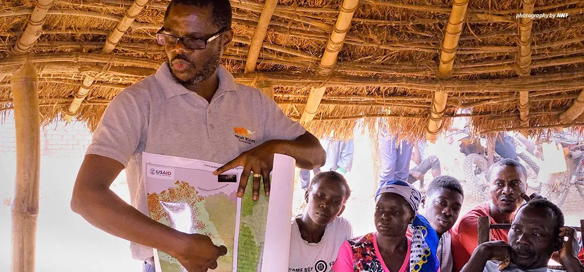 Photo of AWF GIS Technical Advisor sharing land-use mapping results with community