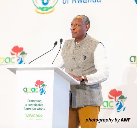 Kaddu Sebunya at a podium.